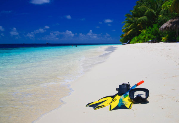 mask and fins on beach