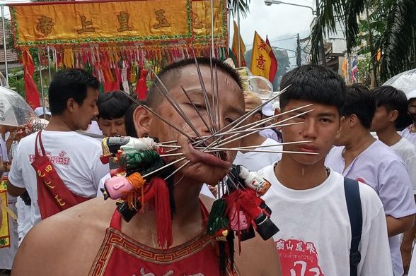 facial piercing at thai vegetarian festival